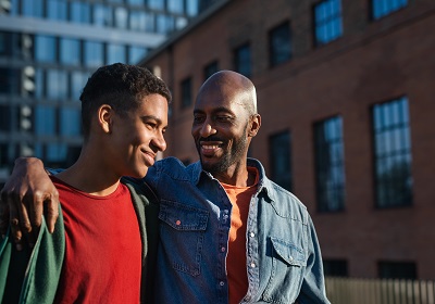 Father and son smiling