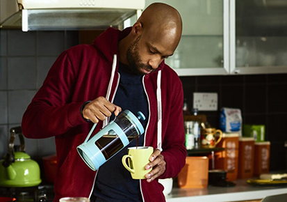 A man pouring coffee