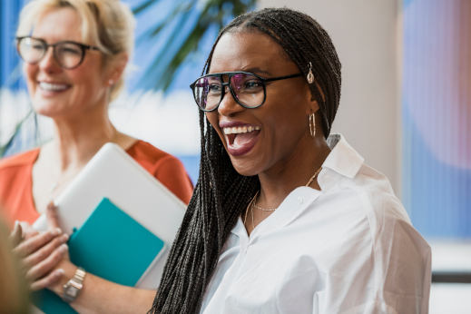 Two smiling business women