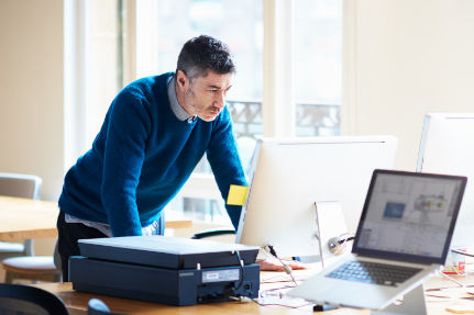 Professional gentleman looking at a computer