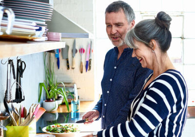 Man and woman cooking dinner together